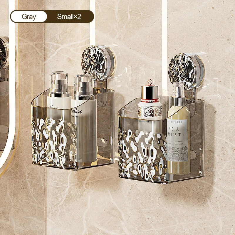 A clear glass storage rack with suction cups holds several bottles and a rollerball perfume, set against a light beige backgr