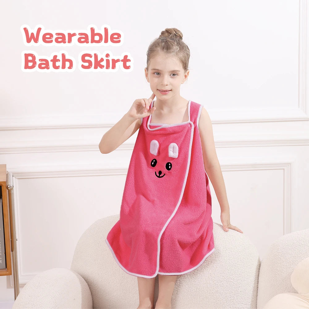 A young girl models a pink wearable bath skirt with bunny ears on her torso.