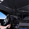 A black car sunshade umbrella is shown deployed inside a car, protecting the windshield.