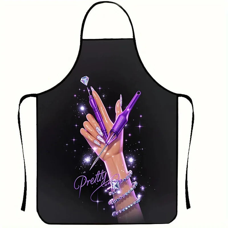 A black apron featuring a purple nail artist design with sparkling glitter and manicured nails.