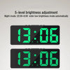 A digital alarm clock displaying 13:06 with a bright green display and dark gray casing.