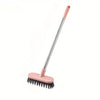 A long-handle floor scrub brush with a pink handle and a pink cleaning pad.