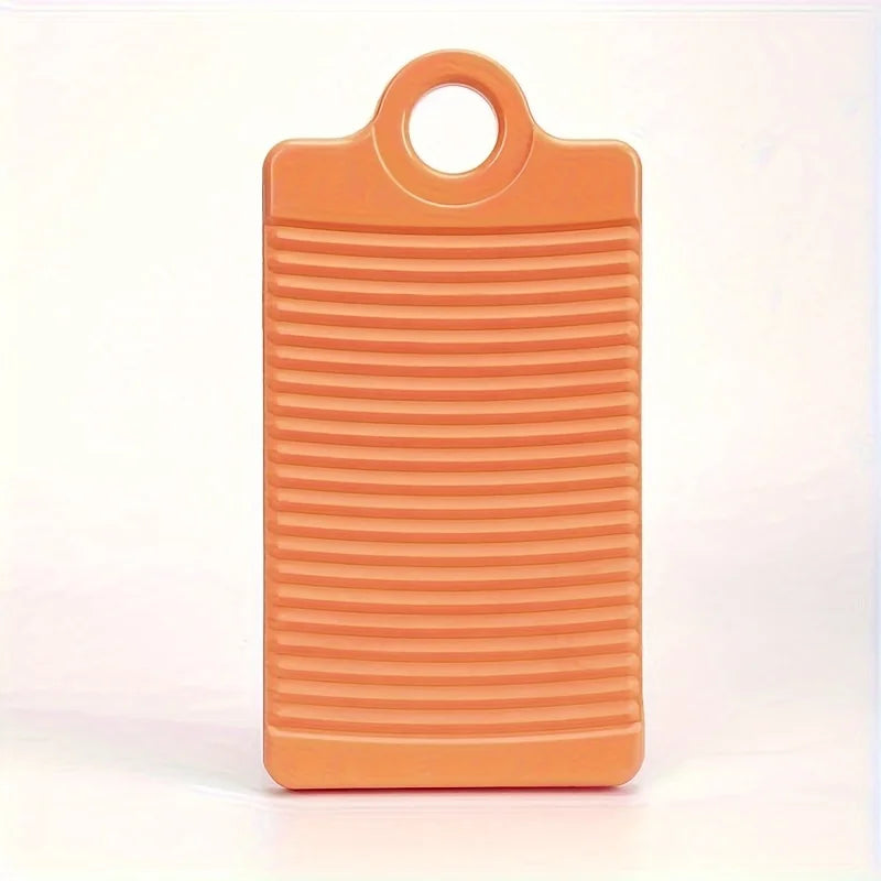 An orange portable anti-slip wash basin with a handle and ribbed texture.