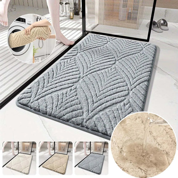 A collection of plush non-slip bathroom rugs in various shades of gray and beige, shown with a close-up view.
