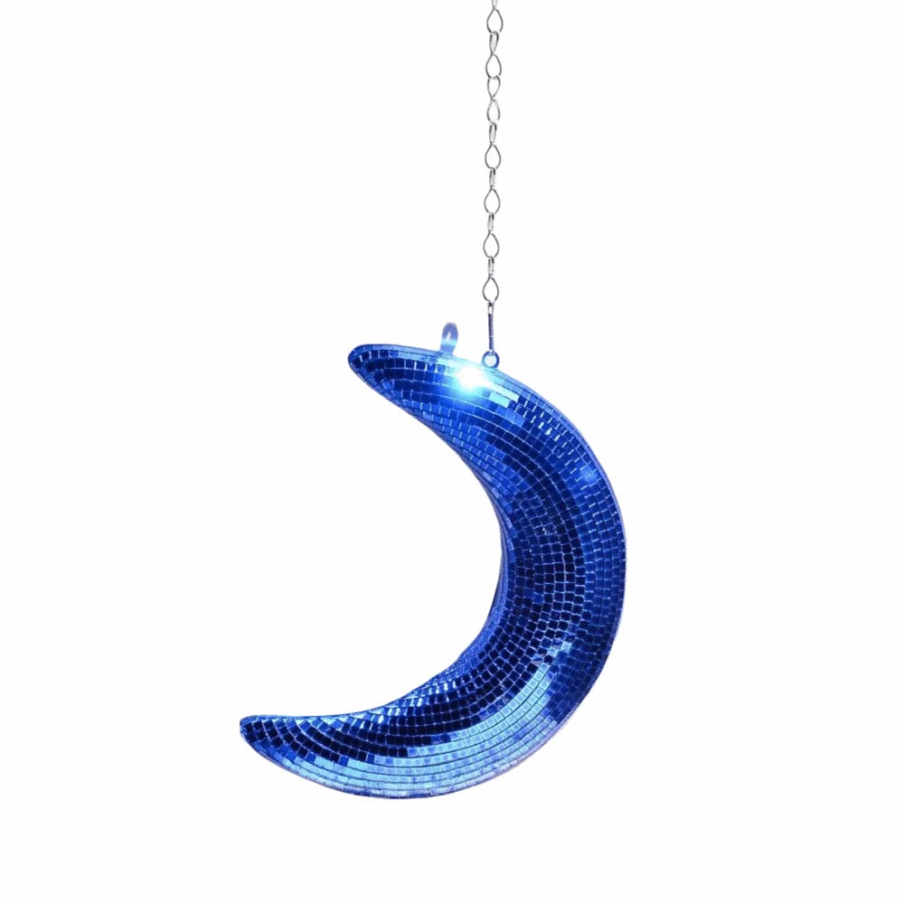 A sparkling blue mosaic moon pendant hanging from a silver chain.