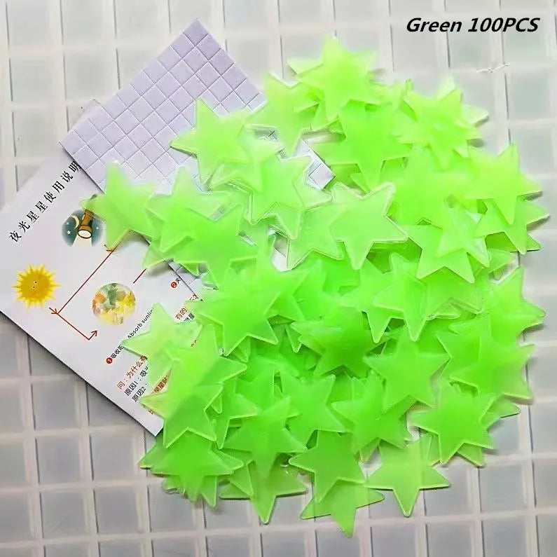 A pile of green glow in the dark 3D star wall decals, with packaging showing usage instructions.