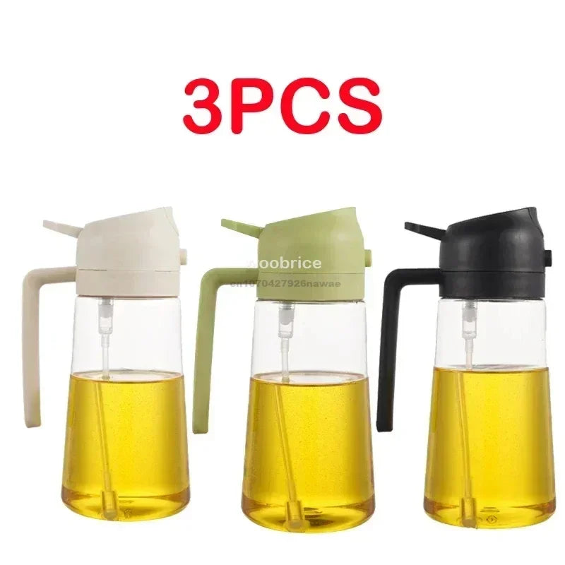 Three clear glass oil spray bottles with black and white tops filled with yellow cooking oil.