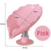 Pink leaf-shaped suction cup soap dish with measurements and stand.