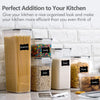 A set of five clear food storage containers filled with dry goods like spaghetti, candy, oats, sugar, pasta, and cookies.