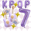 A set of purple balloons shaped like the letters KPOP and the number 7 with golden star accents.