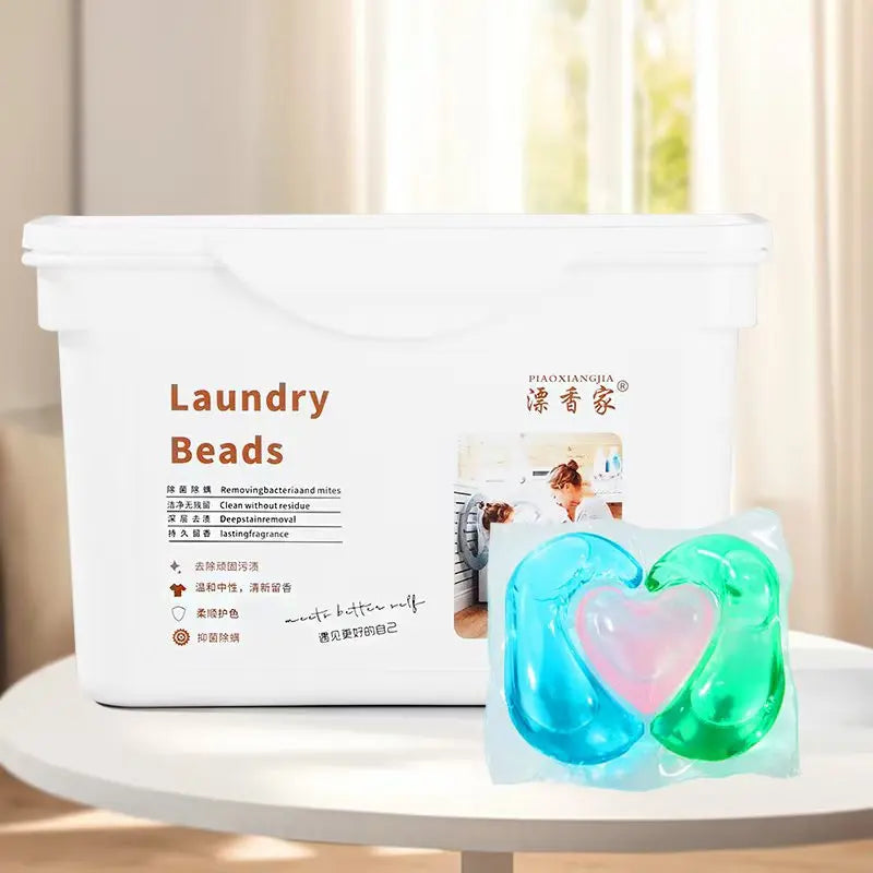 White container of Laundry Beads with a clear package of green and pink beads visible.