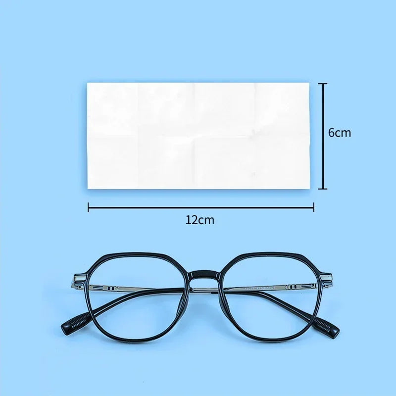 A pair of black eyeglasses is shown next to a rectangular white cleaning wipe, with dimensions indicated.