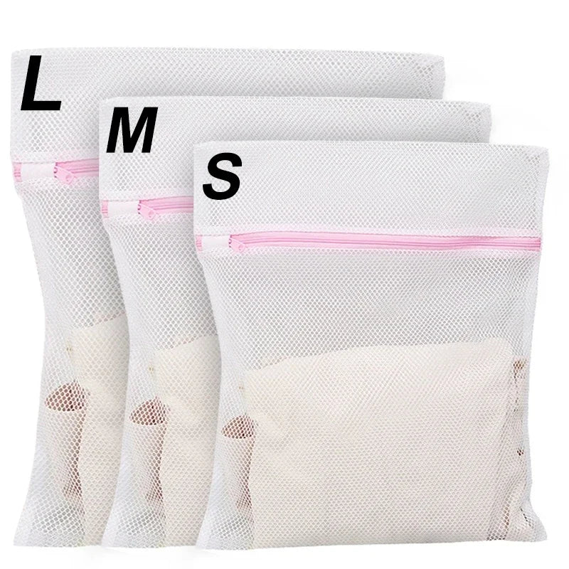 Three mesh laundry bags labeled L, M, and S for delicate clothing