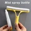 A yellow mist spray bottle with a white sponge applicator is held by a hand against a gray background.