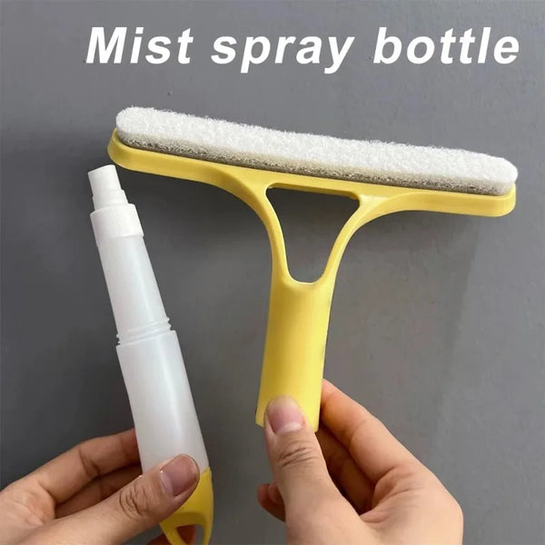 Una botella de spray de niebla amarilla con un aplicador de esponja blanca sostenida por una mano contra un fondo gris.
