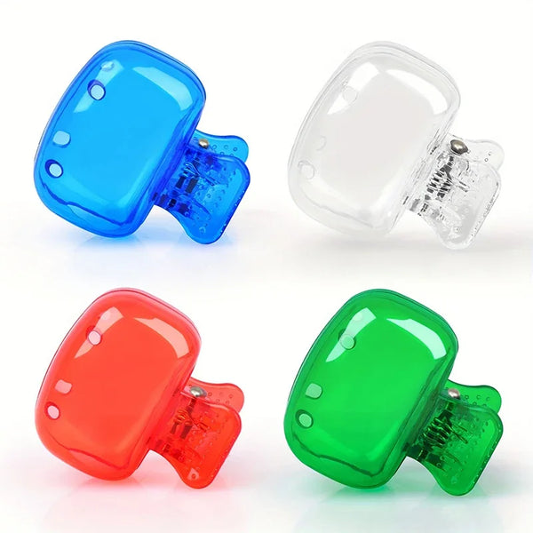 Three colored protective caps for toothbrush holders: blue, clear, red, and green.