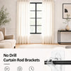 Close-up of heavy duty dual use curtain rod brackets installed on a white wall.