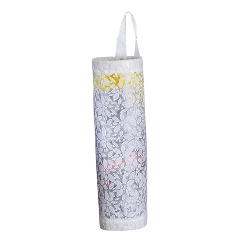 Distributeur de sacs en tissu blanc avec poignée, motif floral et accents colorés.