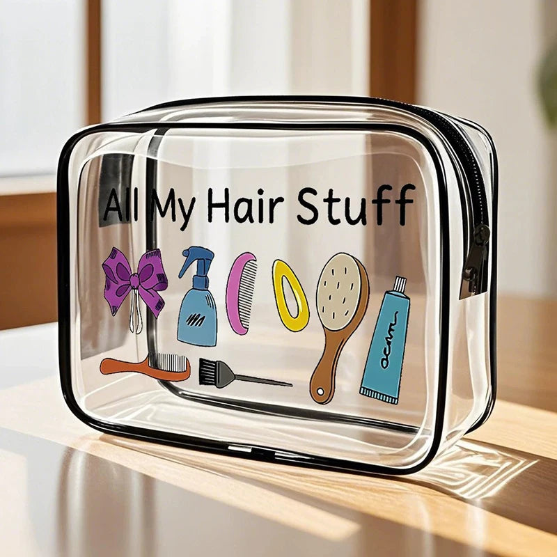 Clear plastic storage pouch labeled All My Hair Stuff containing various hair tools and cosmetics