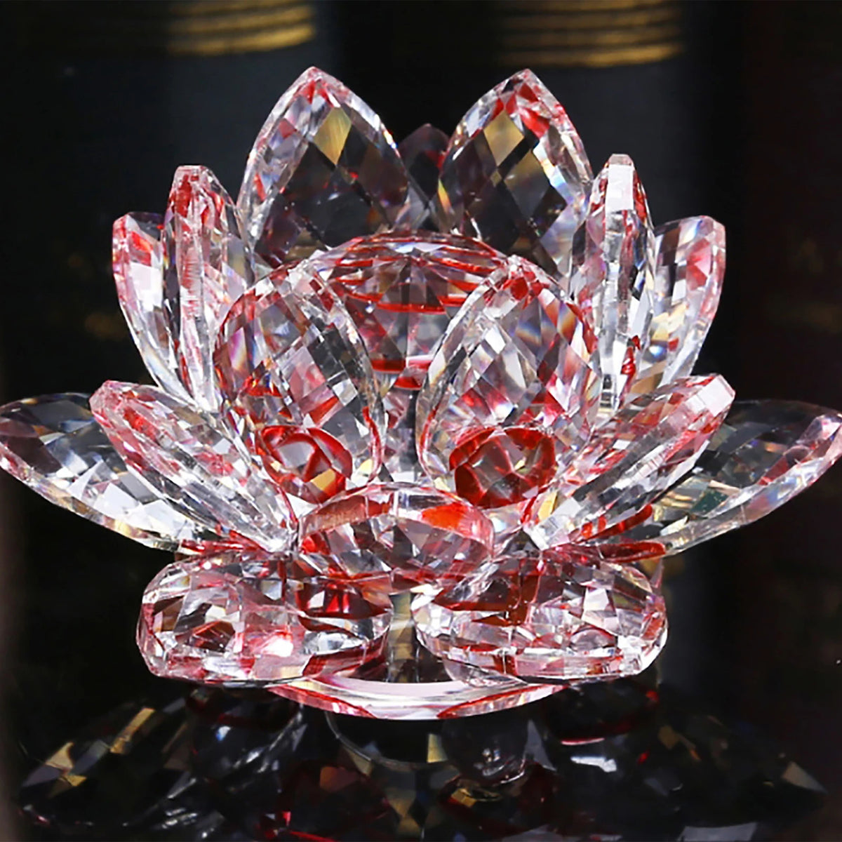 A clear pink crystal lotus flower centerpiece used as tabletop decor.