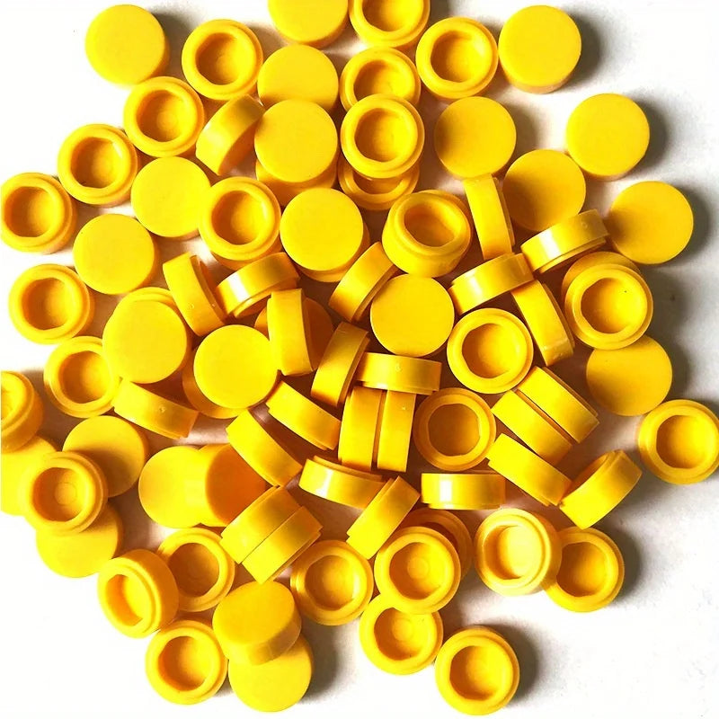 A pile of round yellow building blocks used for DIY projects.