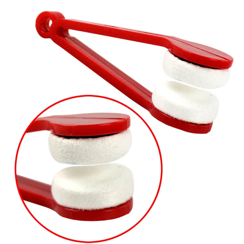 A red cleaning brush set with two white microfiber pads for eyeglasses.