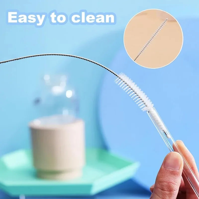 A hand holds a stainless steel straw cleaning brush kit, demonstrating its easy to clean feature.