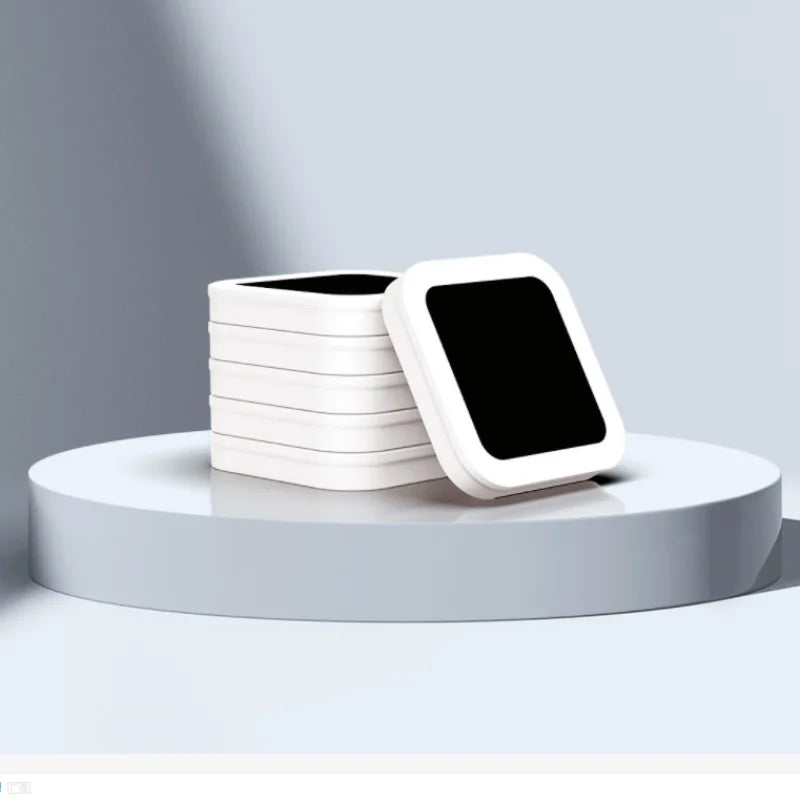 A stack of white reusable refill rings for kitchen trash cans displayed on a light gray surface.