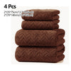 A set of four dark brown microfiber absorbent towels stacked together.