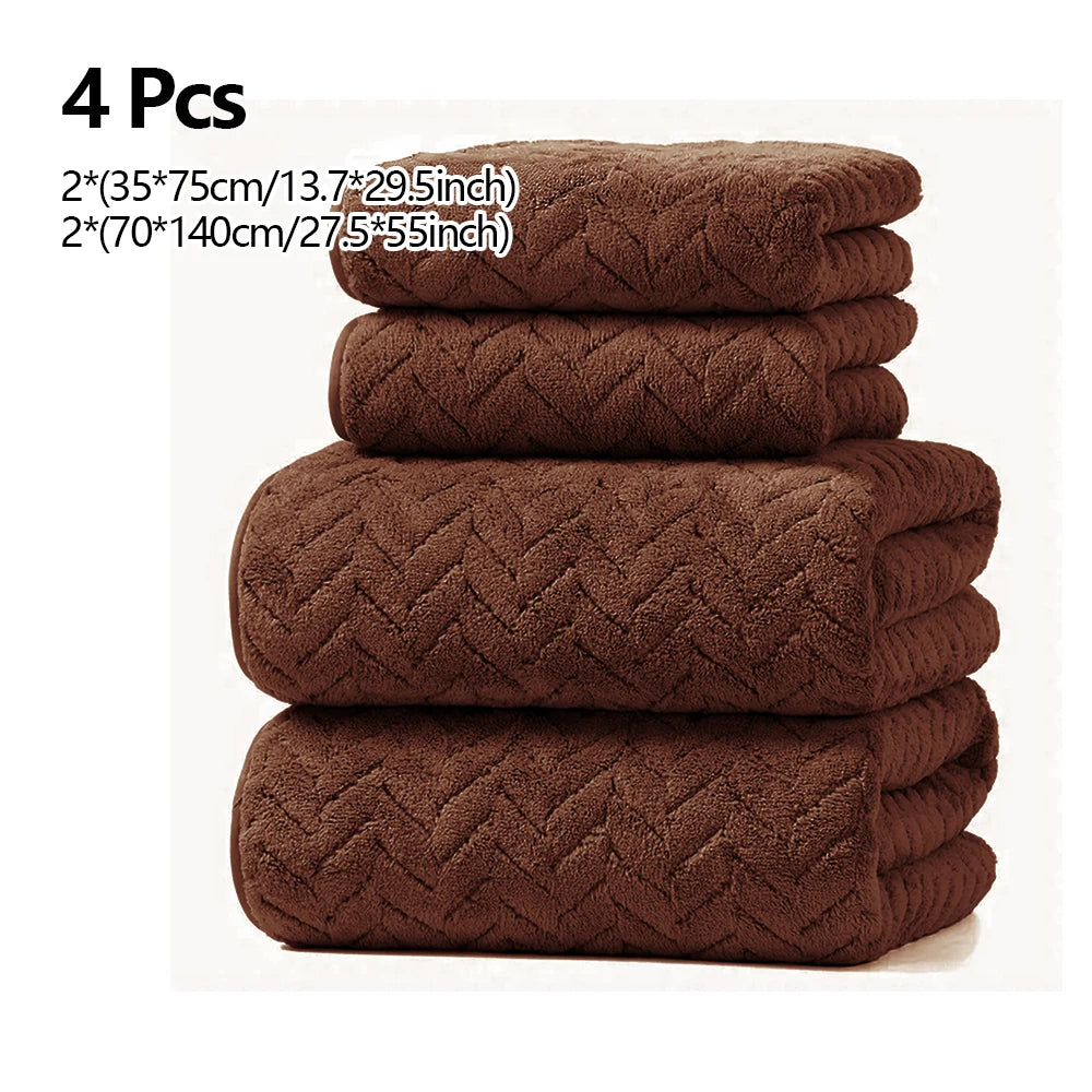 A set of four dark brown microfiber absorbent towels stacked together.