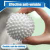 A hand holds a white silicone laundry ball, demonstrating its effective anti-wrinkle and flexible properties.