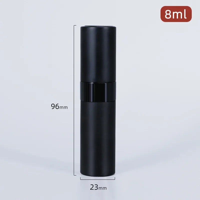 A black, cylindrical perfume spray bottle with a black cap and a 8ml capacity label.