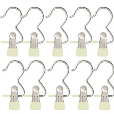 A set of stainless steel clothespins for laundry and organization, shown in various forms.