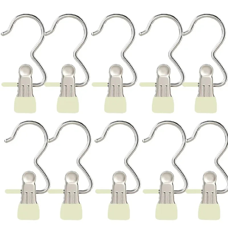 A set of stainless steel clothespins for laundry and organization, shown in various forms.
