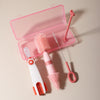 A pink silicone baby bottle cleaning set featuring a bottle, brush, and cleaning tools.