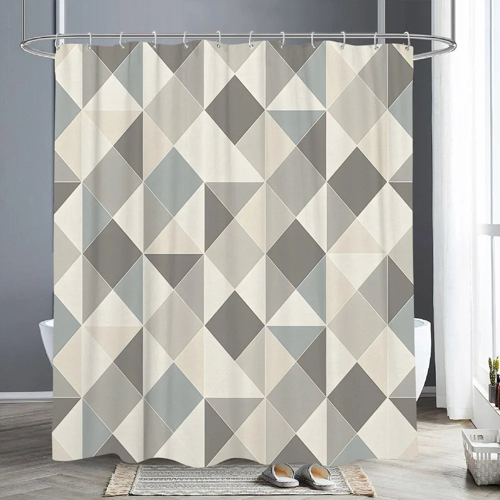 Abstract geometric line shower curtain featuring a pattern of gray and beige triangles.