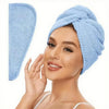 A woman wearing a light blue microfiber hair towel wrap on her head.