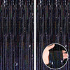 Close-up of a rose gold foil tinsel fringe curtain backdrop set with vertical strands of glitter and light.