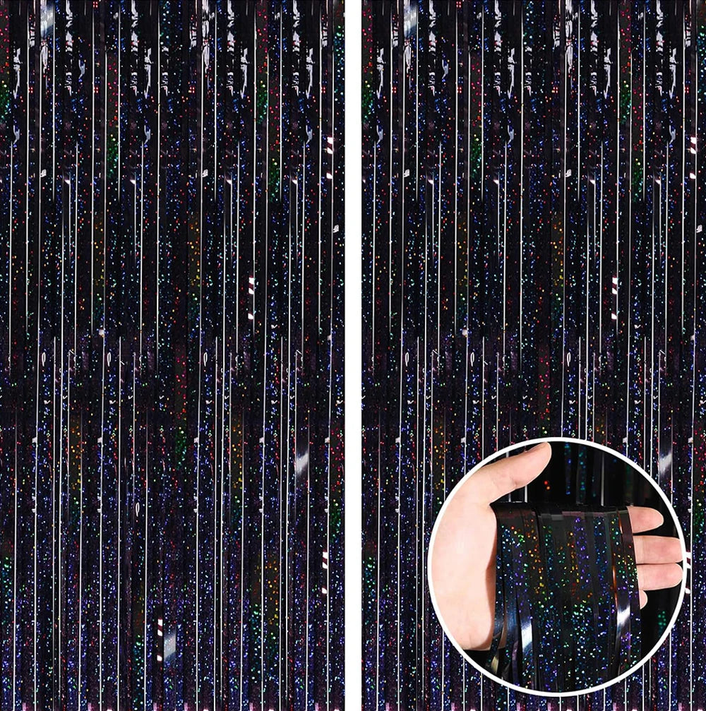 Close-up of a rose gold foil tinsel fringe curtain backdrop set with vertical strands of glitter and light.