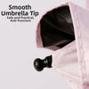 Close-up of a pink lace umbrella tip showing the smooth anti-puncture point.