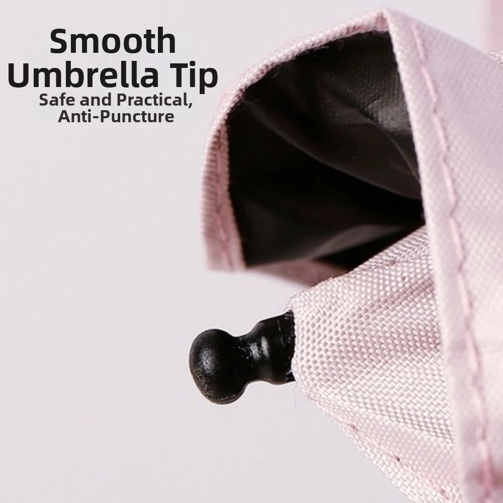 Close-up of a pink lace umbrella tip showing the smooth anti-puncture point.