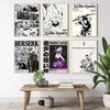 A collection of four black and white anime art posters featuring dynamic characters and dramatic scenes.