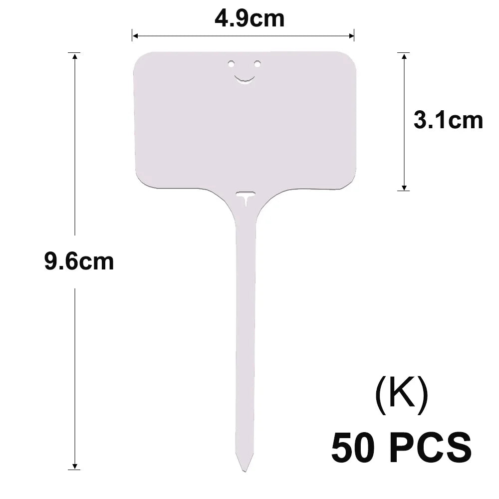 A white T-shaped plant marker with a smiling face, shown with dimensions.