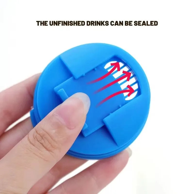 A hand is pressing a blue plastic beverage can seal onto an unfinished drink, demonstrating the sealing function.