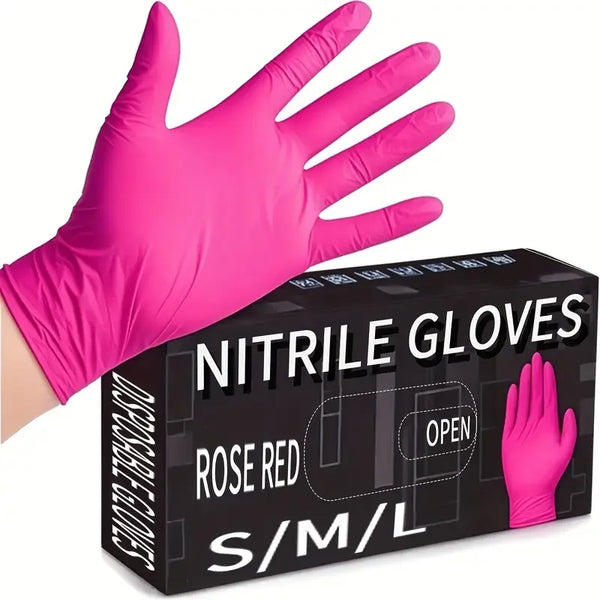 A pink nitrile disposable cleaning glove is shown on a hand, next to its packaging box.