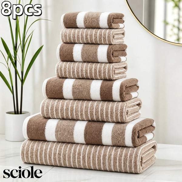 A stack of eight beige and white striped microfiber towels displayed on a white surface.