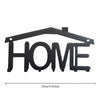 Black rustic metal wall hook key holder shaped like the word HOME