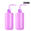 A pair of 500ml squeeze bottles with purple caps and measurement lines for tattoo solutions.