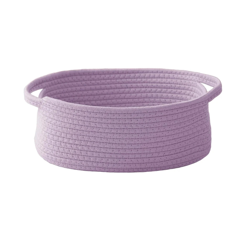 Handwoven rope storage basket in light purple with handles