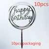 A clear acrylic birthday cake topper with the words Happy Birthday on a stick, shown against a white background.